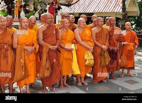 Chiang Mai Thailand Group Of Monks Wearing Orange And Sienna Coloured