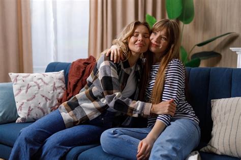 Premium Photo Beautiful Mature Mom And Her Adult Daughter Are Hugging And Smiling While