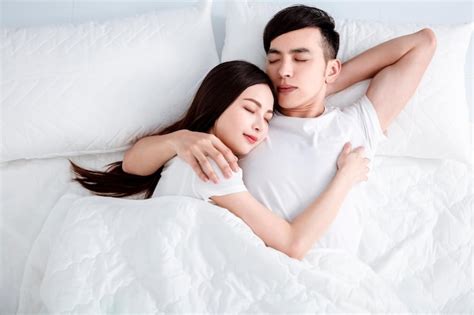 Premium Photo Young Cute Couple Sleeping Together In Bed