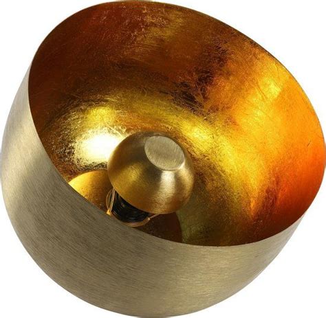 A Gold And Silver Singing Bowl On A White Background