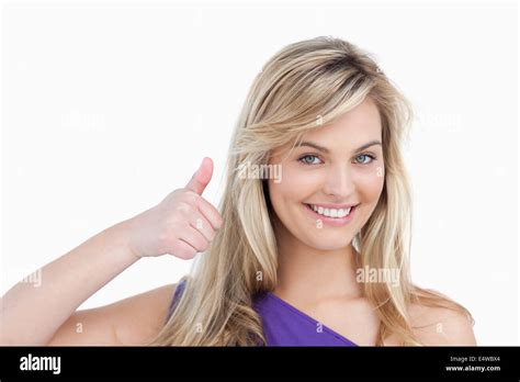 Smiling Blonde Woman Placing Her Thumbs Up Stock Photo Alamy