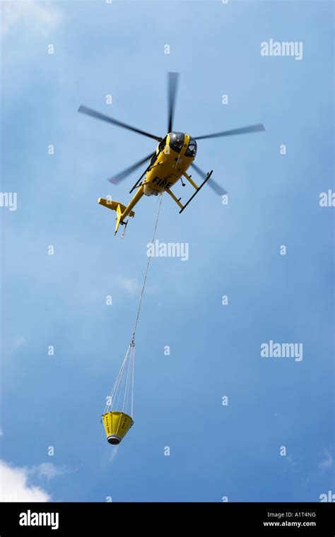 A fire helicopter above Honoapiilani Highway (Rt 30) west of Maalaea ...