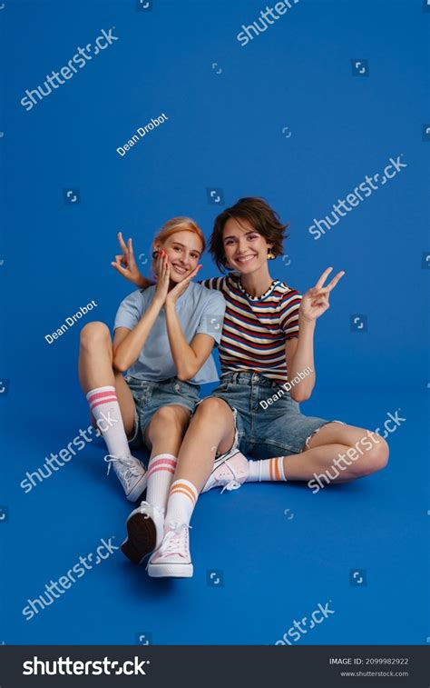 Excited Lesbian Couple Gesturing While Sitting Stock Photo 2099982922 Shutterstock