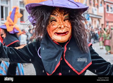 Witch With Big Hat Looks Into The Camera Street Carnival In Southern