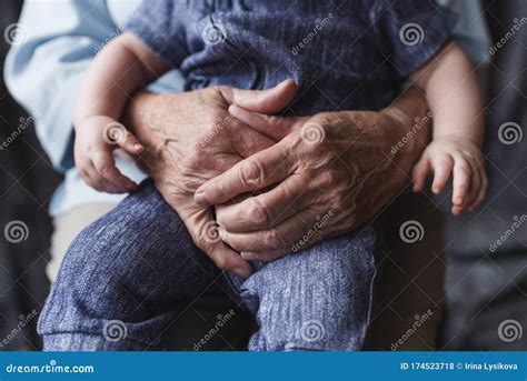 Grandmother Holding Her Grandchild Old And Young Hands Age Concept