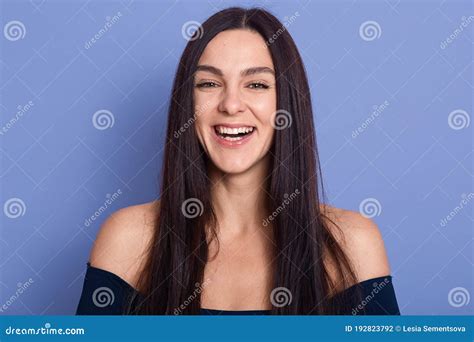 Portrait Of Beautiful Brunette Woman Posing Isolated Over Blue