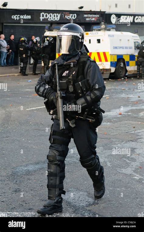 Police Officer In Riot Gear With A Heckler And Koch L104a1 37mm Single Shot Aep Launcher Stock