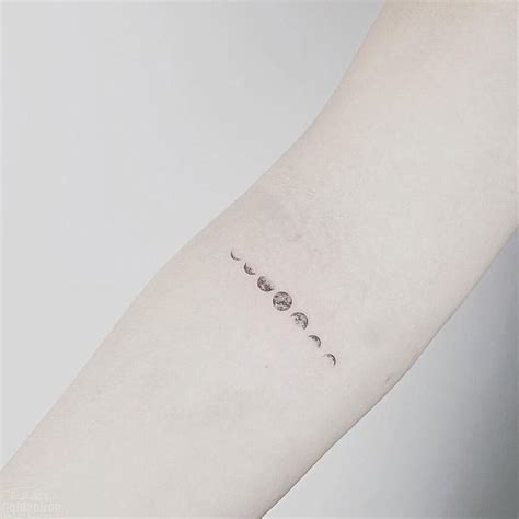 Tiny Lunar Phases Tattoo by Estelle