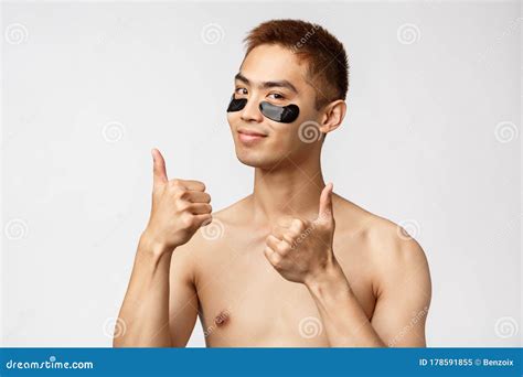 Beauty People And Lifestyle Concept Portrait Of Sassy Good Looking Asian Man With Naked Torso