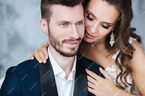 Premium Photo Wedding Couple Hugging Each Other Indoorclose Up