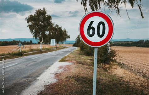 Illuminated Photo Of European Speed Limit Road Sign With Road And