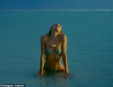 Candice Swanepoel Says She Ran Into SHARKS When Posing In A Skimpy Green Bikini While Visiting A