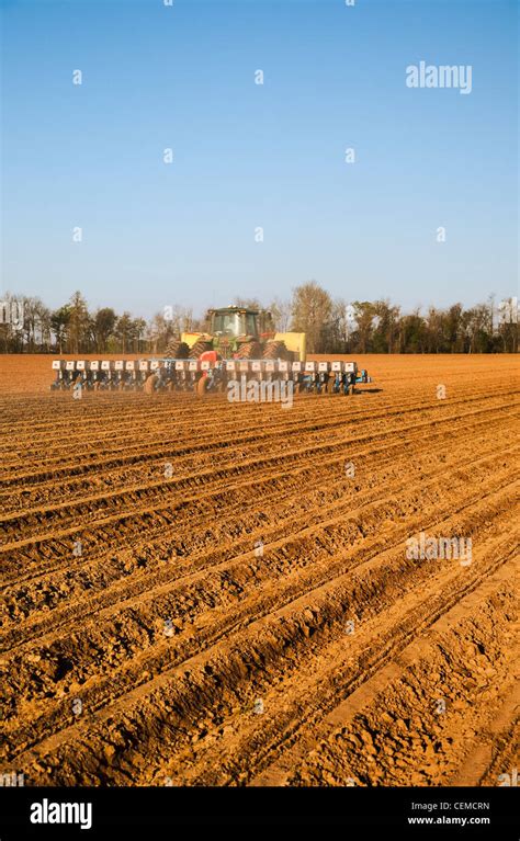 Agriculture A John Deere Tractor And Monosem Twin Row Planter