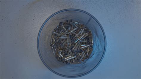 Empty Bullet Shells in a Bin · Free Stock Video