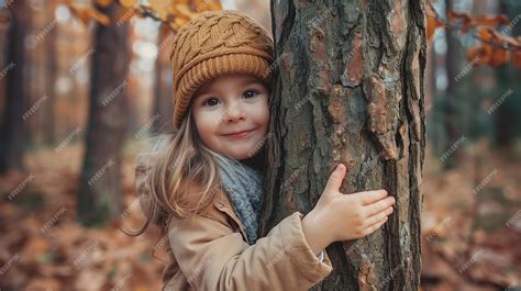 Premium Photo Girl Hugging A Tree In The Forest