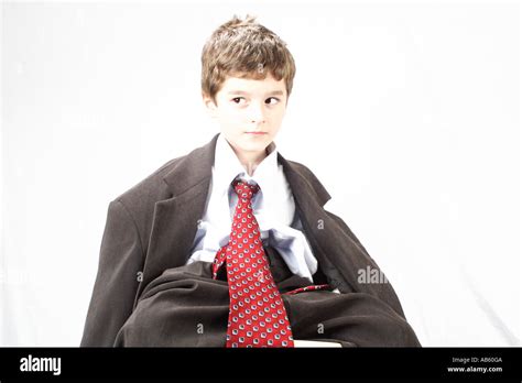 Little boy wearing his fathers jacket Stock Photo - Alamy