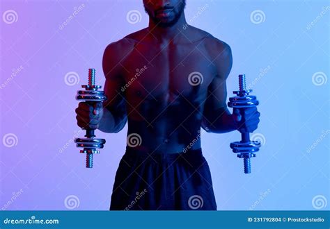 Unrecognizable Black Weight Lifter With Torso Working Out With