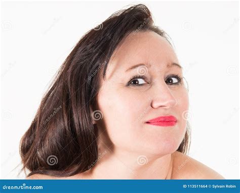 Portrait Of Mature Woman Smiling At Camera With Nude Shoulders On