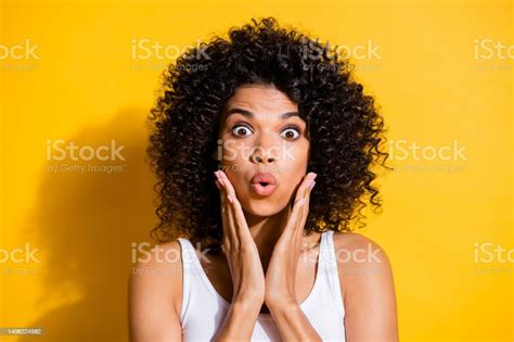 Photo Of Impressed Shocked Young Dark Skin Lady Wear White Singlet Arms