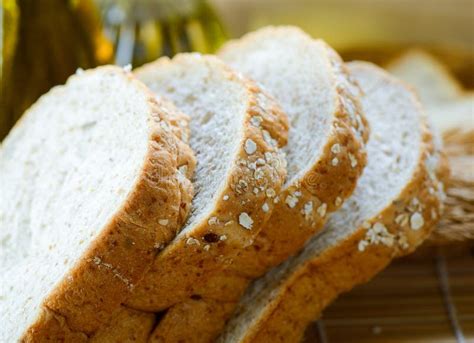 Whole Wheat Bread Slices on Table Stock Photo - Image of oats, healthy ...