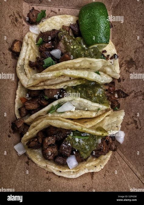 Three fresh delicious Mexican steak tacos Stock Photo - Alamy