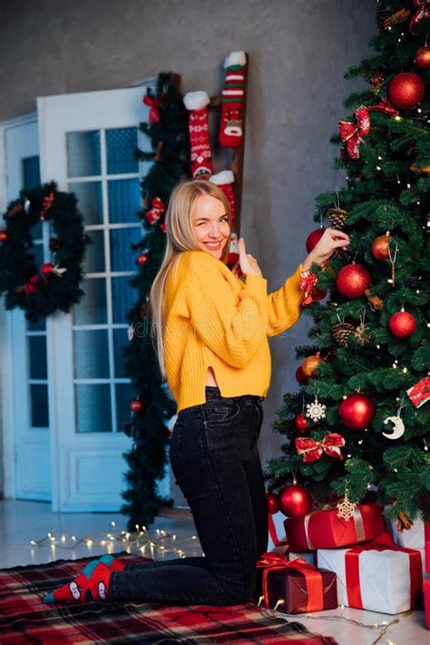 Blonde Woman Decorating Christmas Tree With Gifts For The New Year Stock Image Image Of