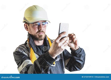 Positive Friendly Bearded Male Builder In Overalls Safety Helmet And