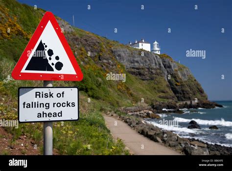 Risk Of Falling Rocks Sign At Blackhead Lighthouse And The Whitehead To