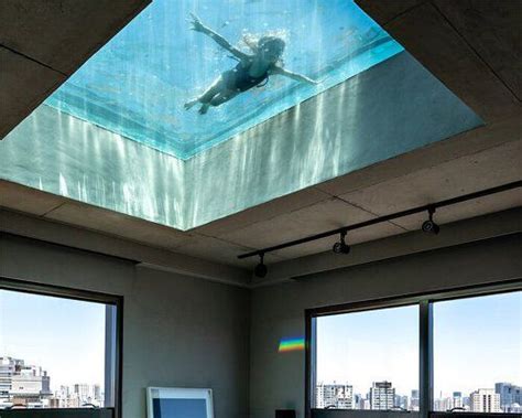 All Glass Swimming Pool Filters Sunlight Within Spacious Penthouse