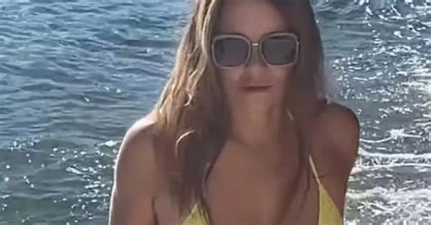 Liz Hurley 59 Sports Thong Bikini And Rubs Lotion On Herself In Steamy Beach Clip Daily Star