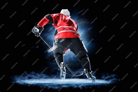 Premium Photo | Ice hockey player isolated on black background