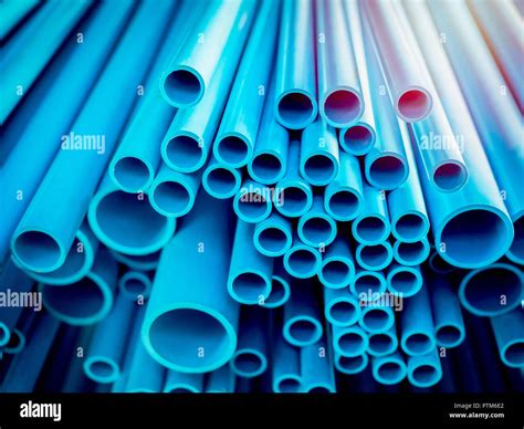 Tubes Pvc Pipes Stacked In Warehouse Blue Pvc Pipes Background With