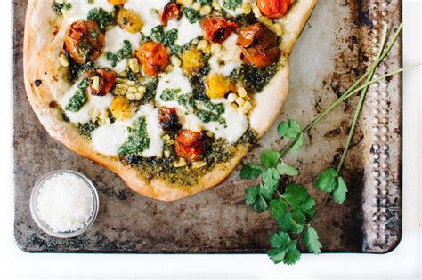 CILANTRO PESTO PIZZA WITH ROASTED TOMATOES CORN BURRATA Kale