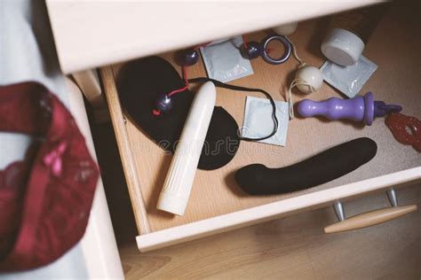 Bedside Table Or Nightstand Drawer Full Of Sex Toys Stock Photo Image