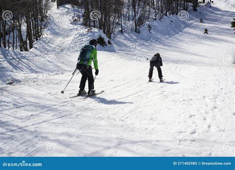 Group Of Unrecognizable Skiers On The Slope At Mountain Stock Image