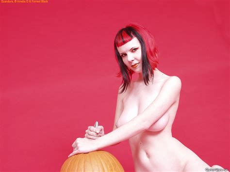 Naked Babe Szandora Poses With A Carved Pumpkin Photos
