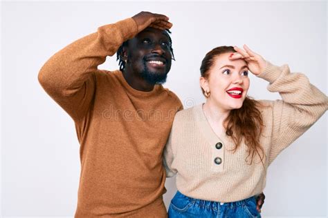 Interracial Couple Wearing Casual Clothes Very Happy And Smiling