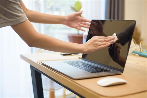 woman is cleaning laptop by alcohol spray 5140999 Stock Photo at Vecteezy