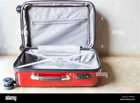 Opening suitcase for packing the cloth Stock Photo - Alamy