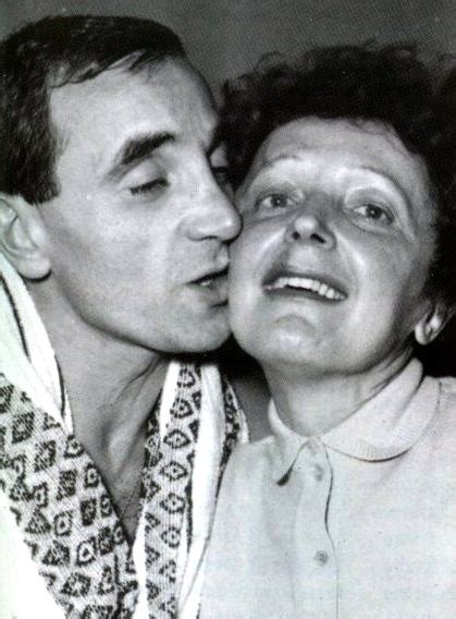 An Old Black And White Photo Of A Man Kissing A Woman S Face With Her