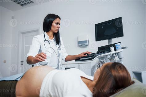 Female Doctor Does Ultrasound For A Pregnant Woman In The Hospital