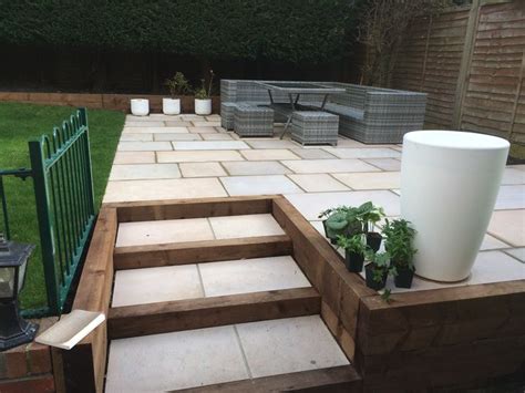 Raised Patio Area With Incorporated Steps Within Timber Frame Patio