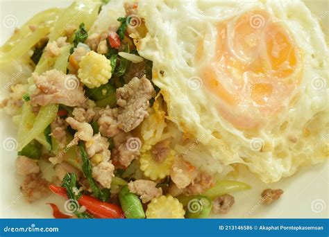 Spicy Stir Fried Chop Pork With Vegetable And Basil Leaf On Rice Couple