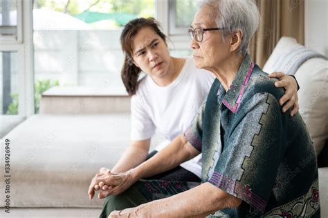 Caregiver Woman Is Taking Care Support Of Sad Senior Depressed Elderly