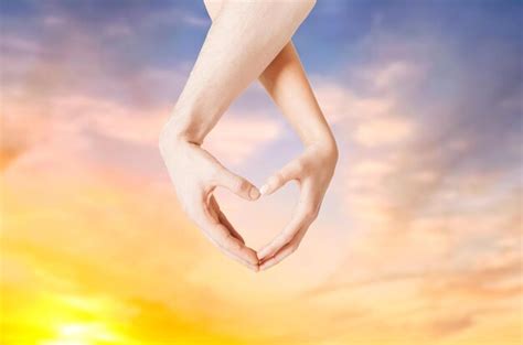 Premium Photo Close Up Of Couple Hands Showing Heart Gesture