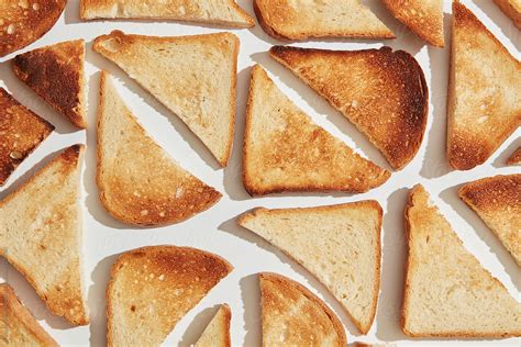 Pieces Of Fried Croutons Of Bread In Shape Of A Square Del