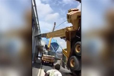 Utter Carnage As Massive Crane Carrying Water Tower Topples Over And