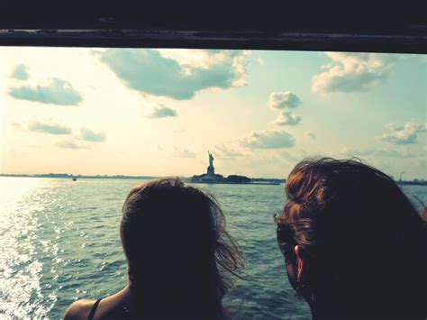 Premium Photo Rear View Of Women In Boat Looking At Statue Of Liberty