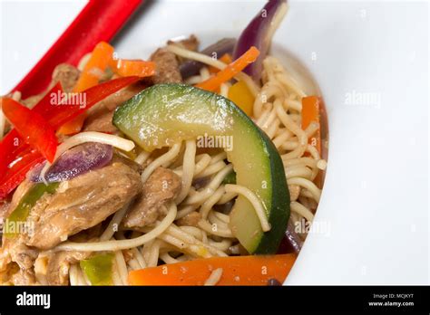 Chinese style Spicy Chicken and egg noodle stir fry Stock Photo - Alamy