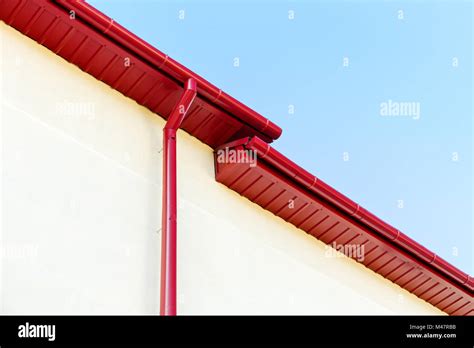 Red Rain Gutter System On Rooftop Stock Photo Alamy